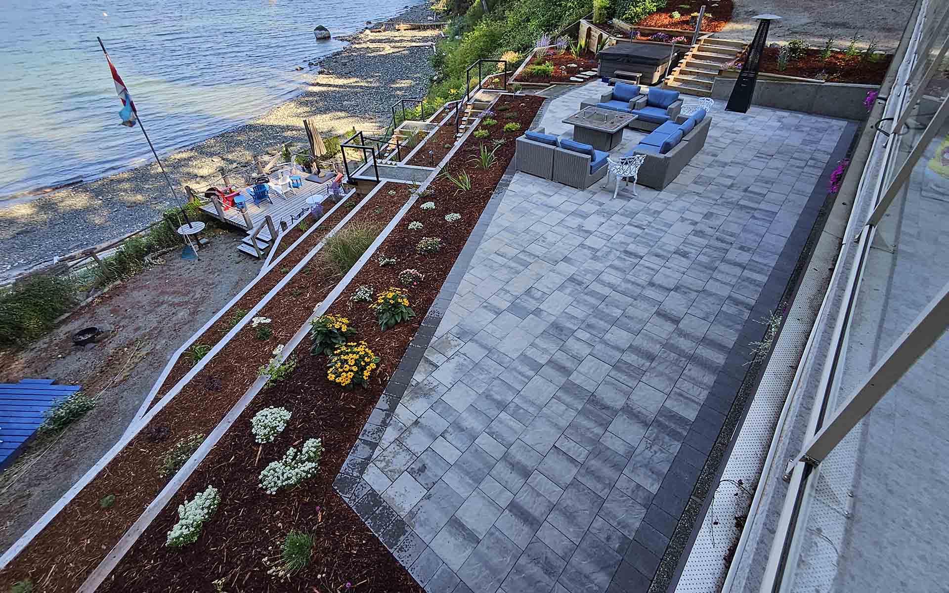 tile seating area with hot tub - ladysmith landscapers 2022